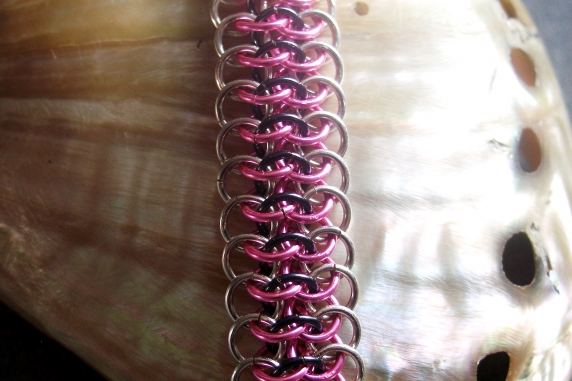Sterling silver, pink, and blue-black Crotalus bracelet by Handmaden Designs LLC