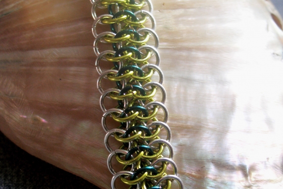 Sterling silver, lime green, and teal Crotalus bracelet by Handmaden Designs LLC