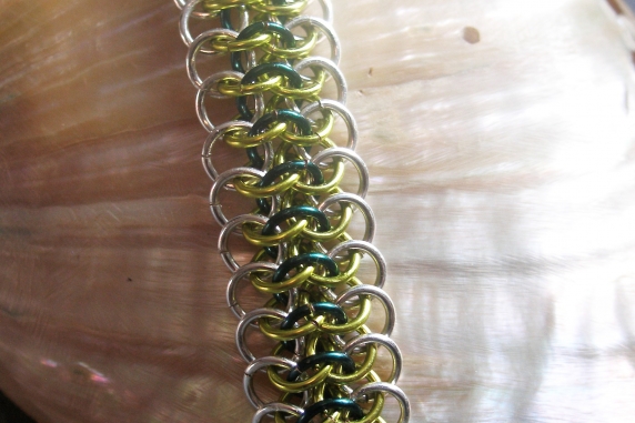 Sterling silver, lime green, and teal Crotalus bracelet by Handmaden Designs LLC