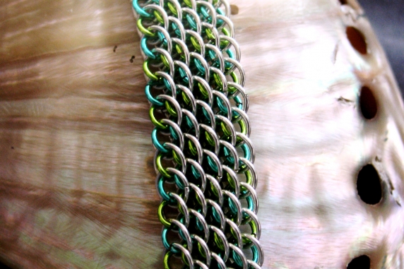 Sterling silver and aqua and lime green enameled copper Dragonscale bias bracele