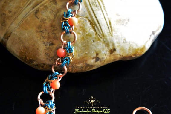 Copper and enameled copper Half-Romanov chainmaille bracelet with Pink Coral