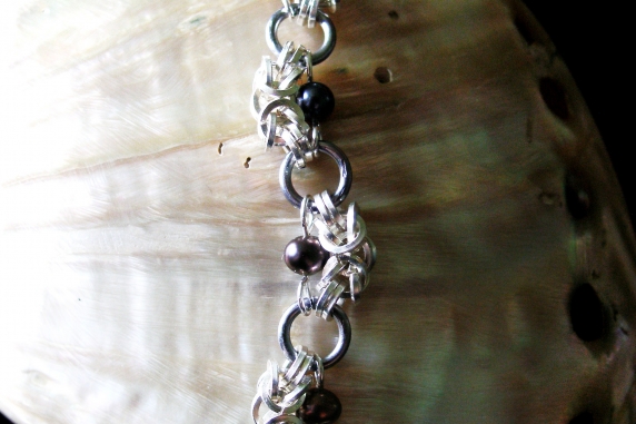Half Romanov sterling silver, tantalum, and freshwater pearl bracelet.