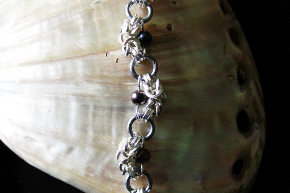 Half Romanov sterling silver, tantalum, and freshwater pearl bracelet.