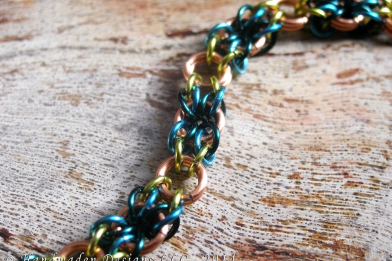 Copper, lime green, teal, and blue Snakes Eyes bracelet by Handmaden Designs LLC