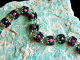 Copper and enameled copper Romanov chainmaille bracelet with Ruby Zoisite