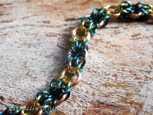 Copper, lime green, teal, and blue Snakes Eyes bracelet by Handmaden Designs LLC